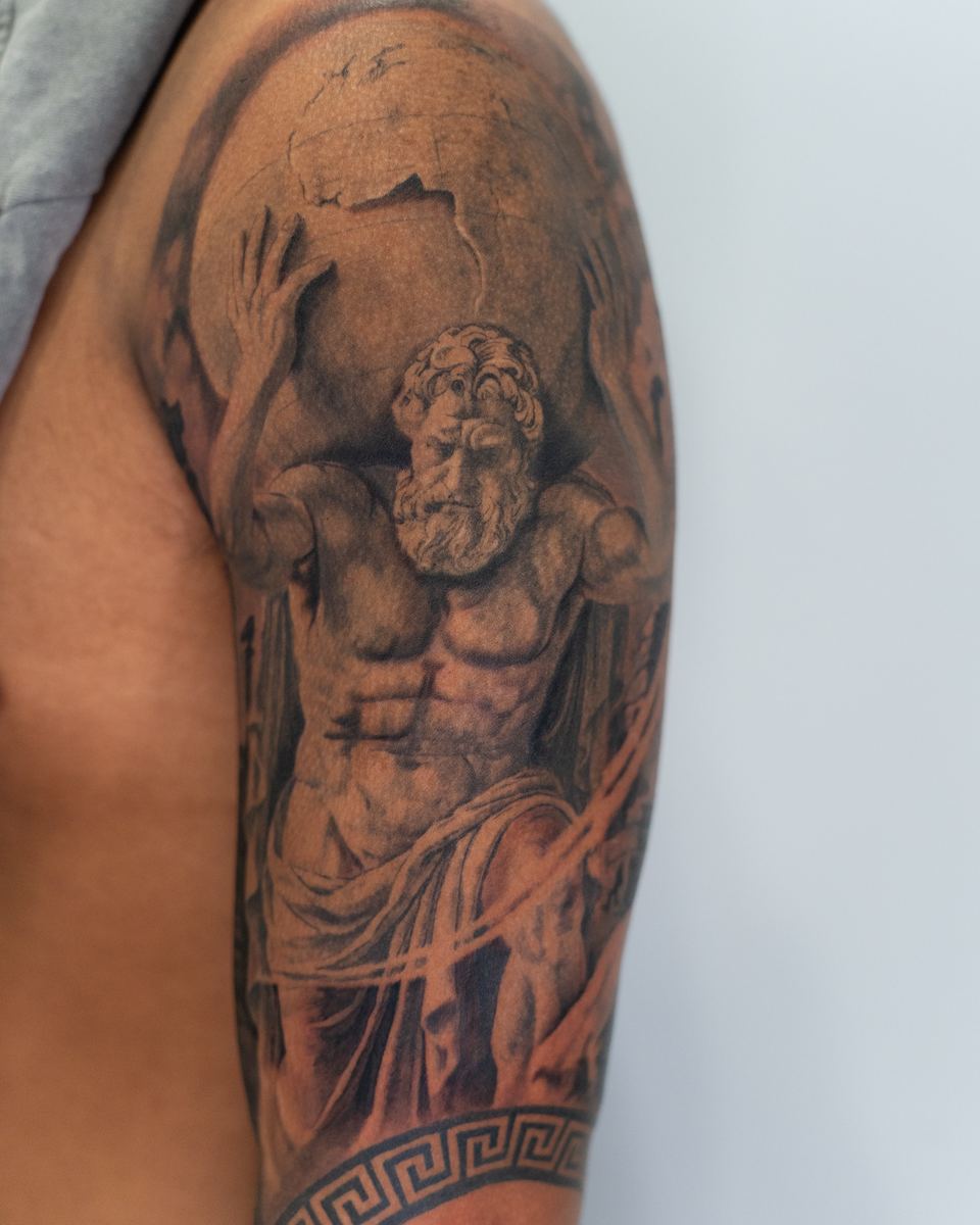 Atlas holding globe shoulder piece